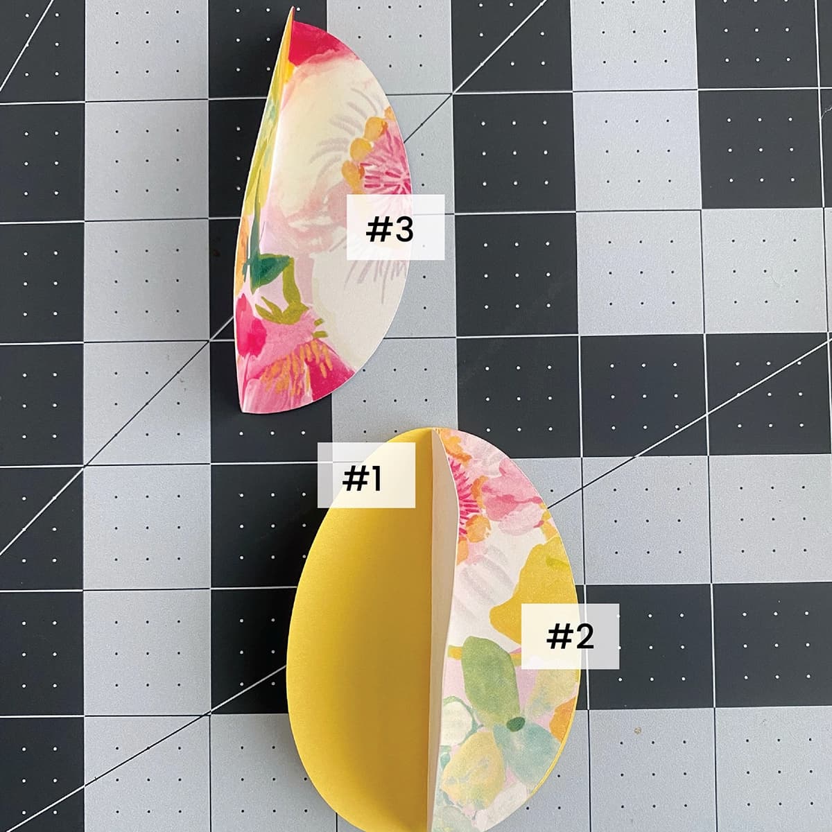 Two floral-patterned egg shapes on a grid background with labels.