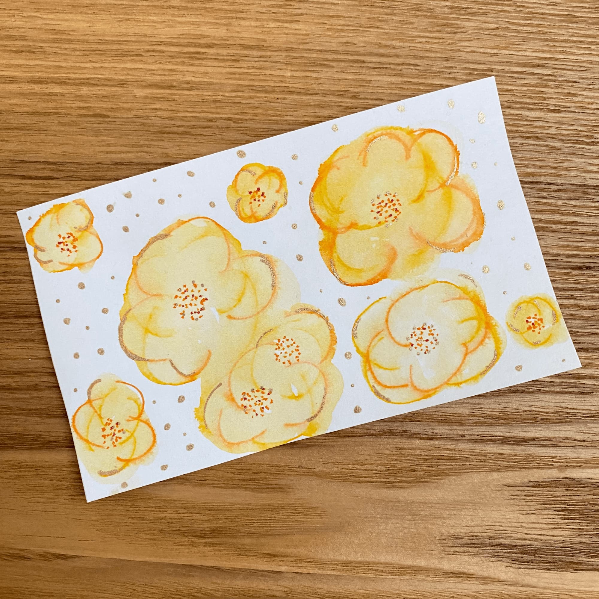 sketch on index card of yellow blossoms and metallic gold dots