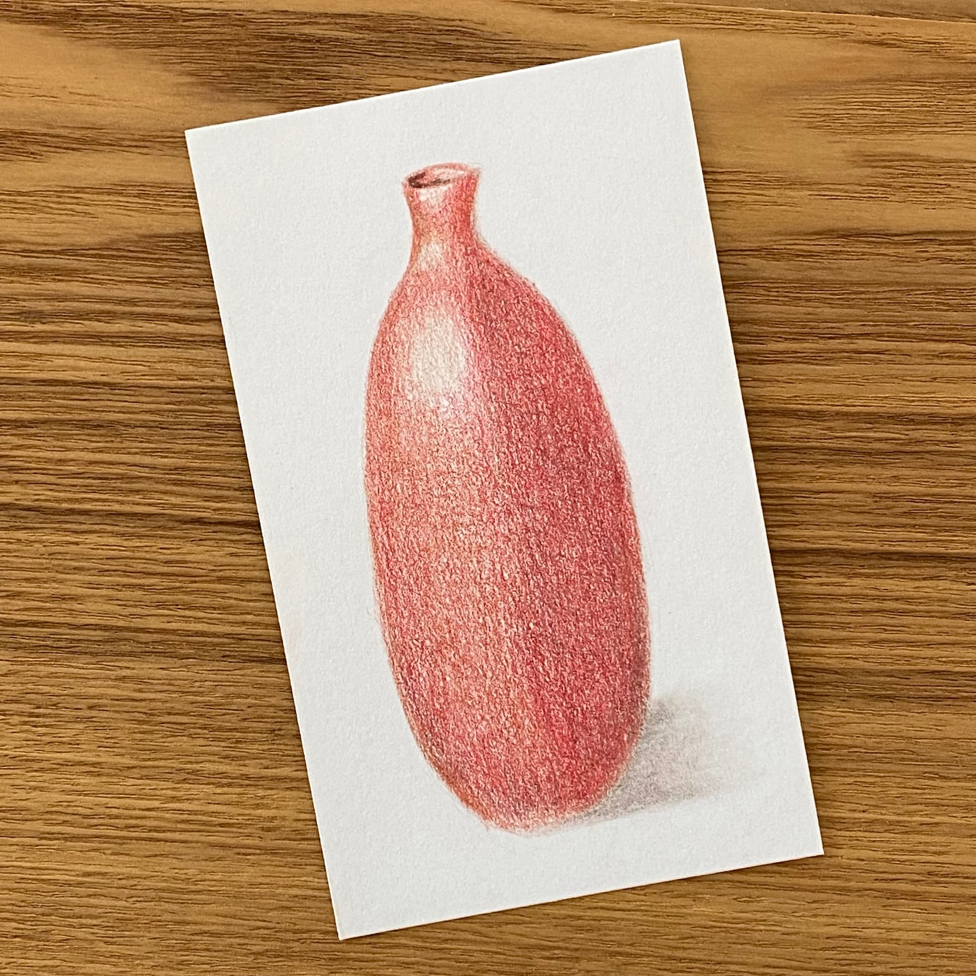 colored pencil sketch of a red vase and shadow.