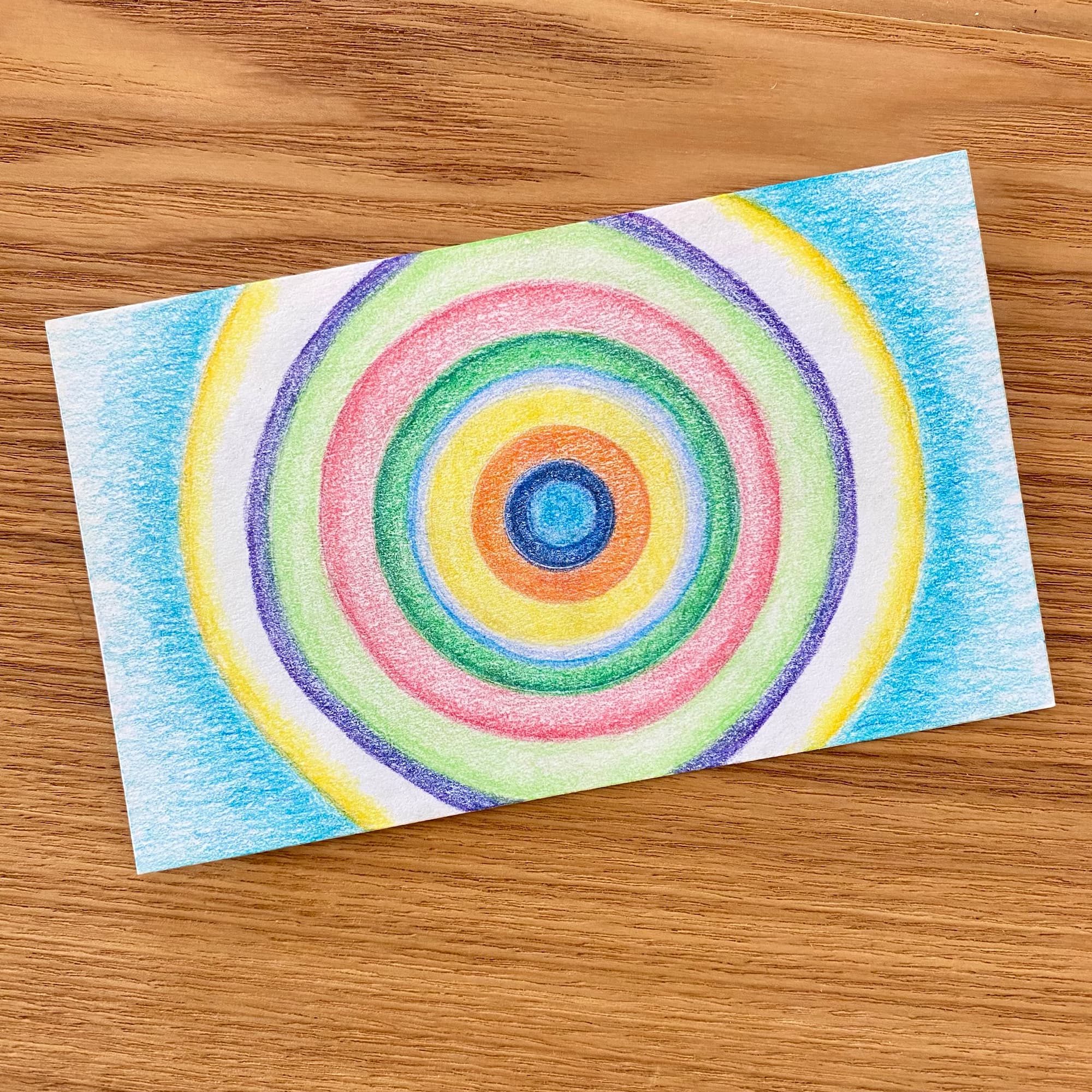 image of concentric circles, each done with a different color pencil