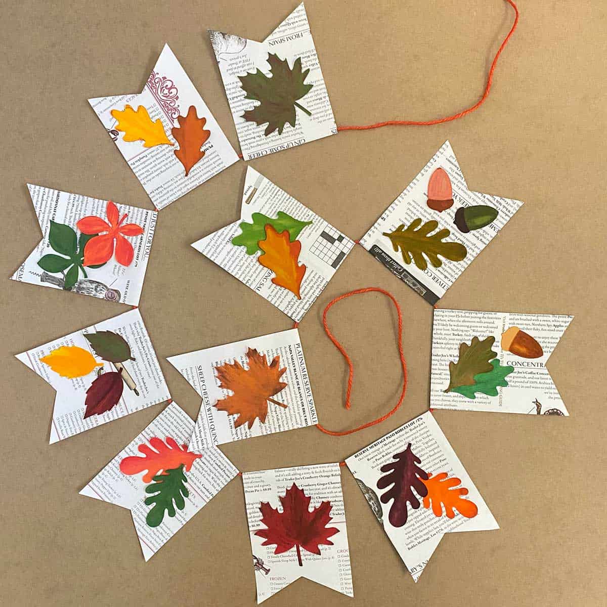 Leaf-themed paper flags with colorful leaves on a brown background