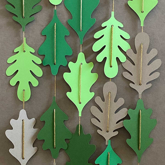 Paper leaves in shades of green  together in vertical garlands for CakewalkDIY.