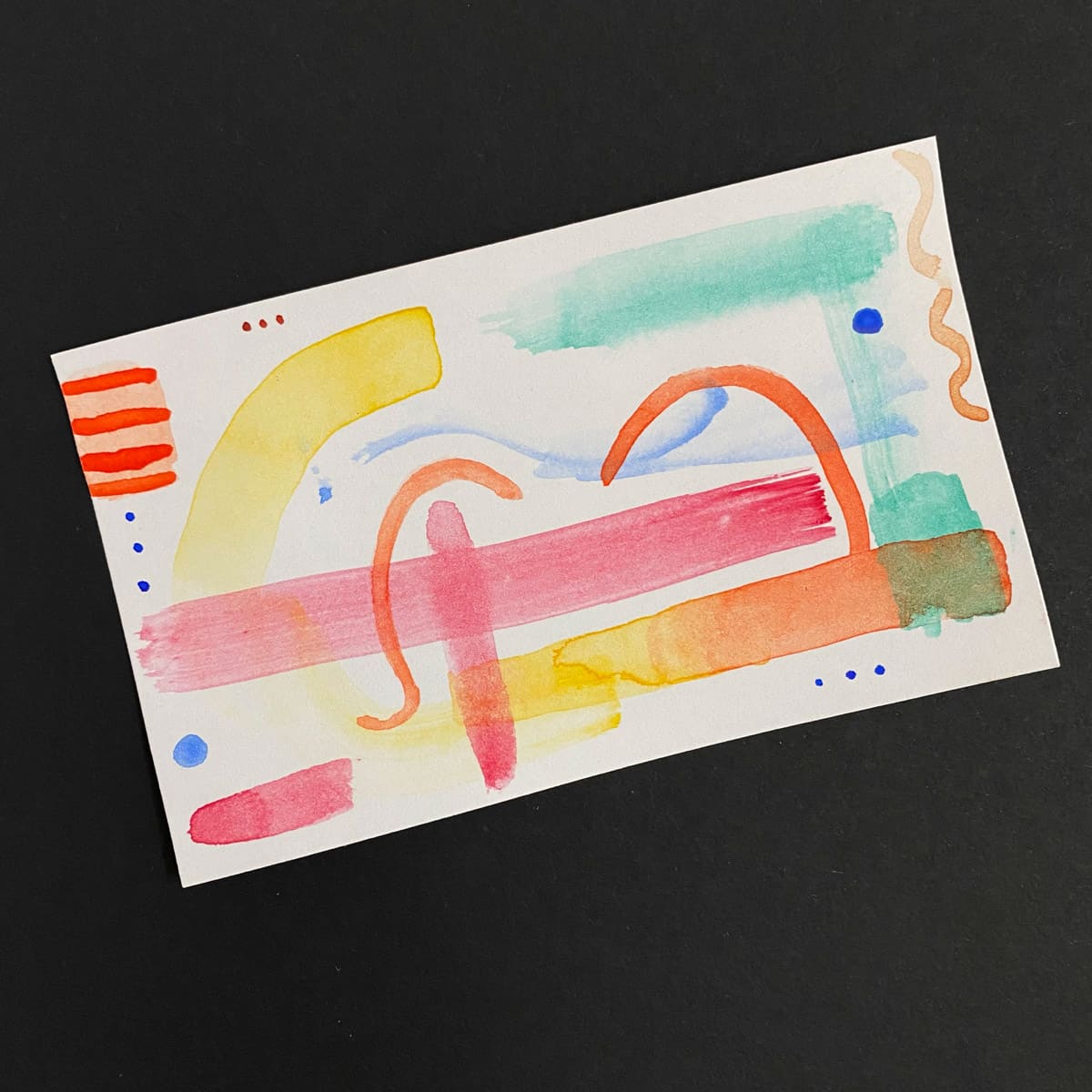 Index card with abstract watercolor painting on a black background by Mozaic Studio for ICAD 2025.