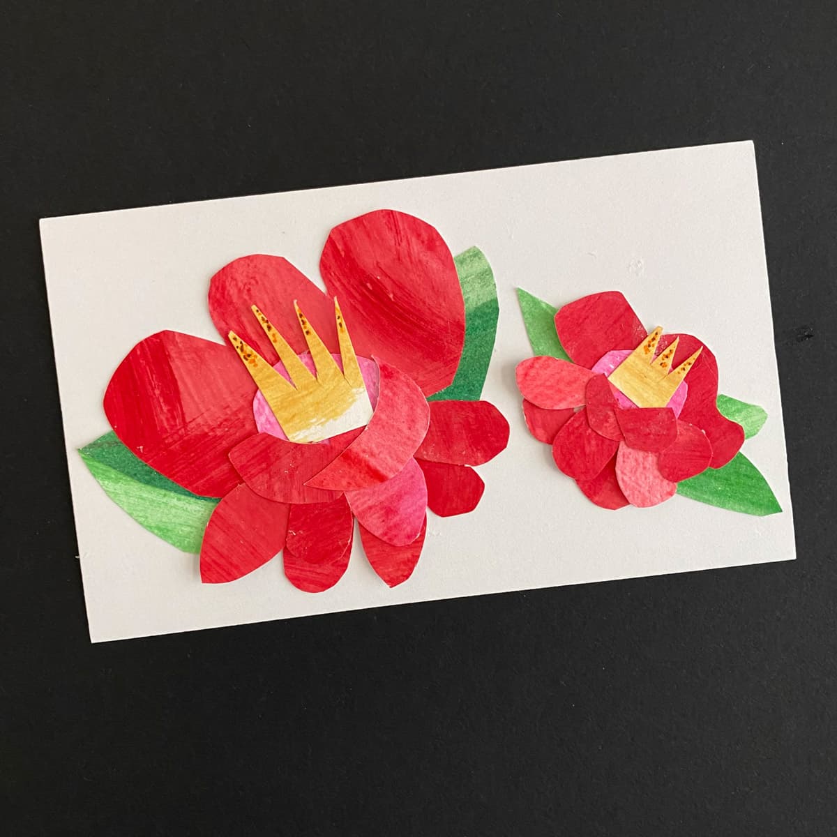 Index card with a floral collage of red roses with green leaves down with painted paper on a black background by Mozaic Studio for ICAD 2025