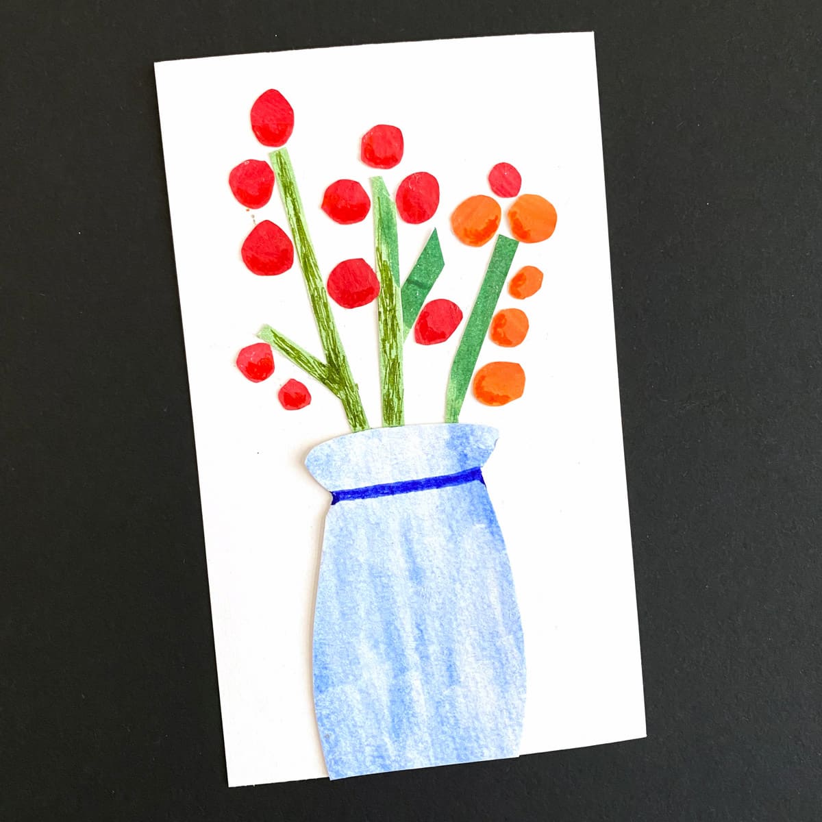 Index card with a floral collage made with painted paper on a black background by Mozaic Studio for ICAD 2025
