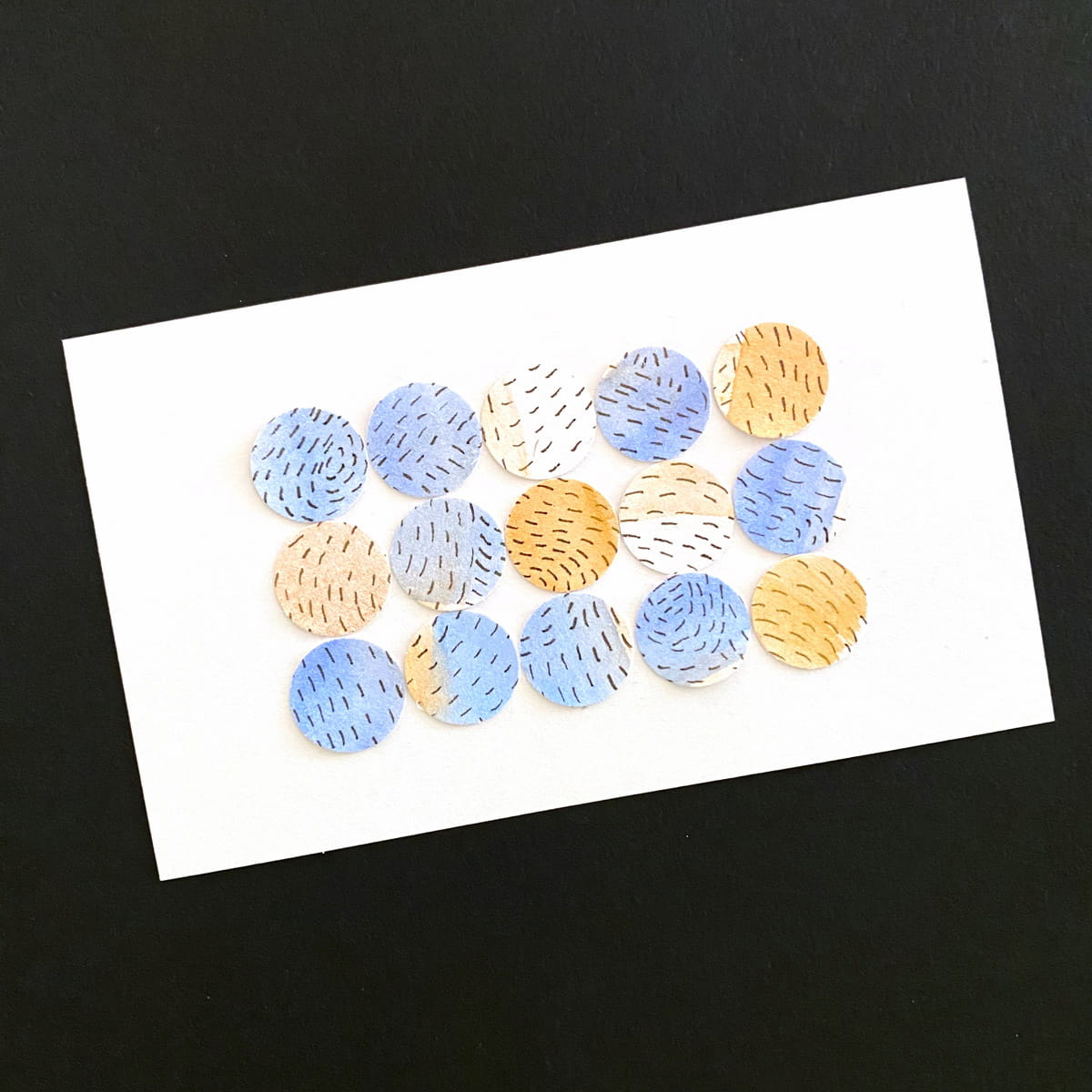 Index card with a lemon stamp and ink with pen detailing of a lemon imprint in yellow and black on a black background by Mozaic Studio for ICAD 2025.