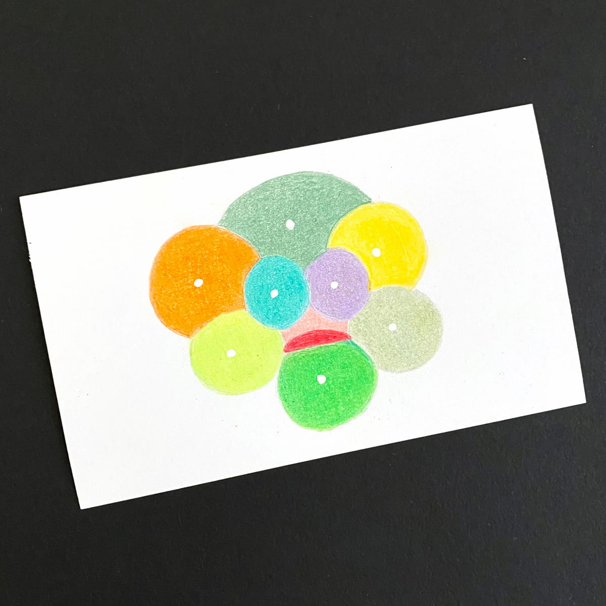 Index card with an abstract illustration of overlapping, multicolored circles on a black background by Mozaic Studio for ICAD 2025