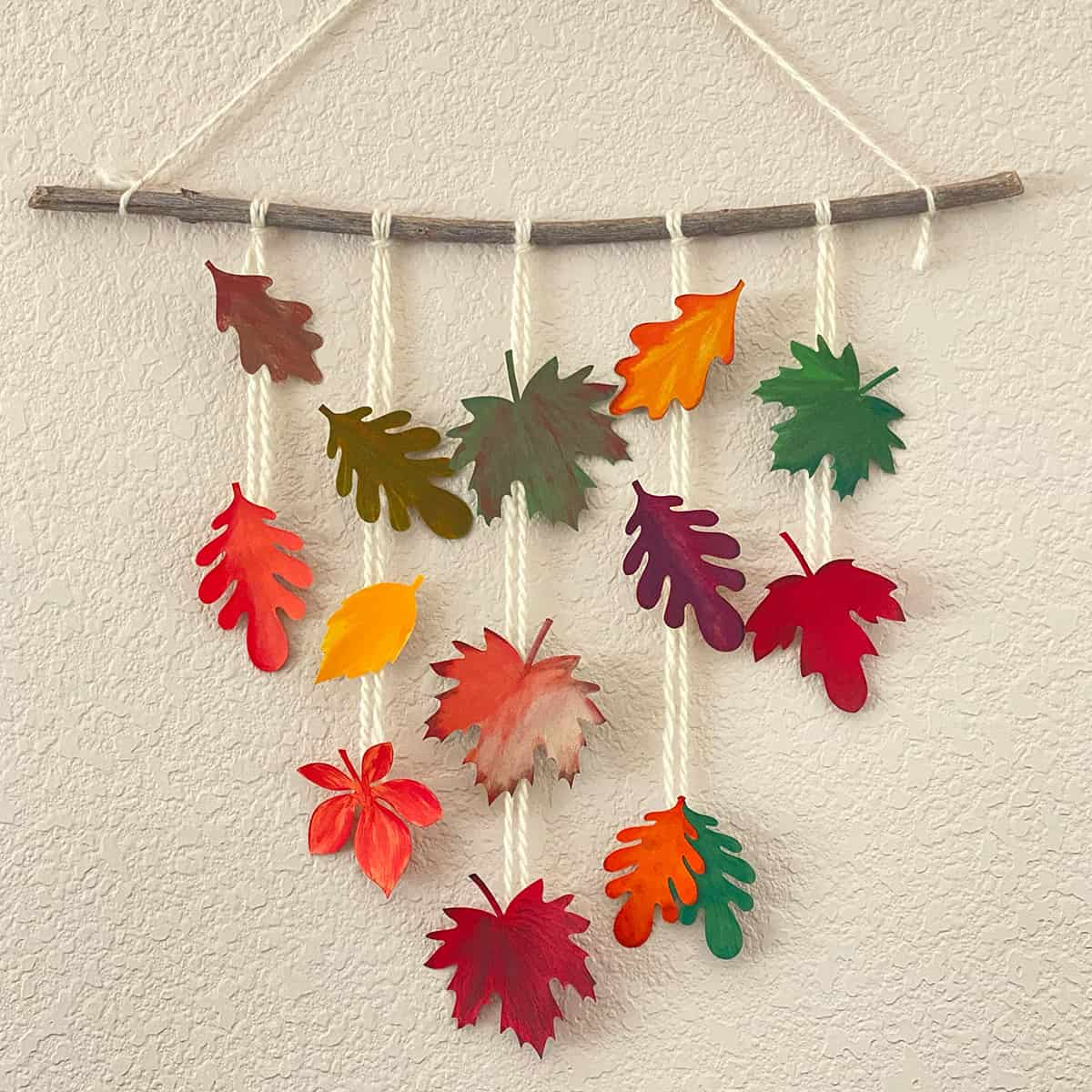 Hanging mobile of painted paper leaves for the Cakewalk DIY Paper Craft tutorial.