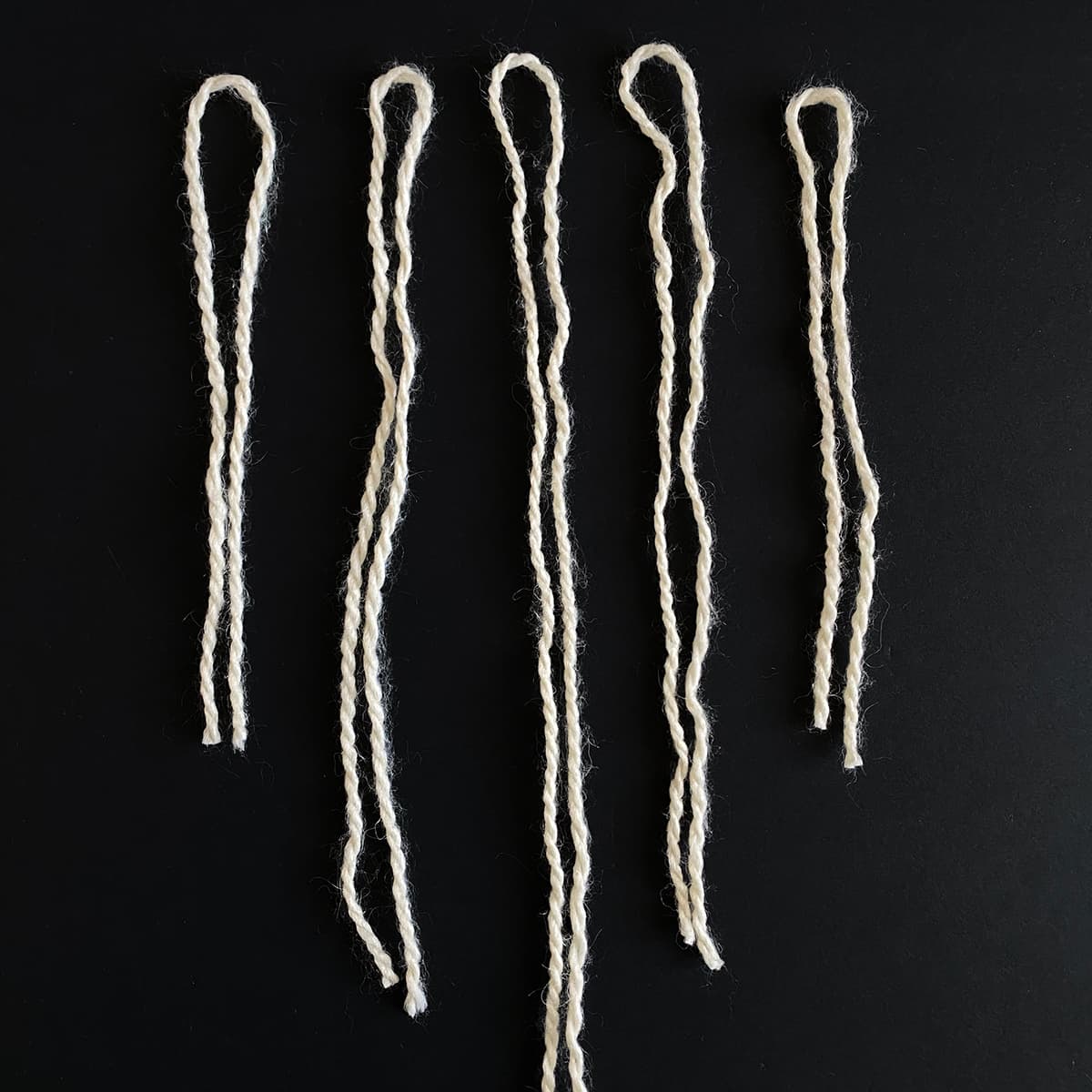 Lengths of twine cut for DIY leaf mobile, featured in Cakewalk DIY Paper Craft tutorial.